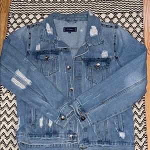 Lightly distressed jean jacket with studs